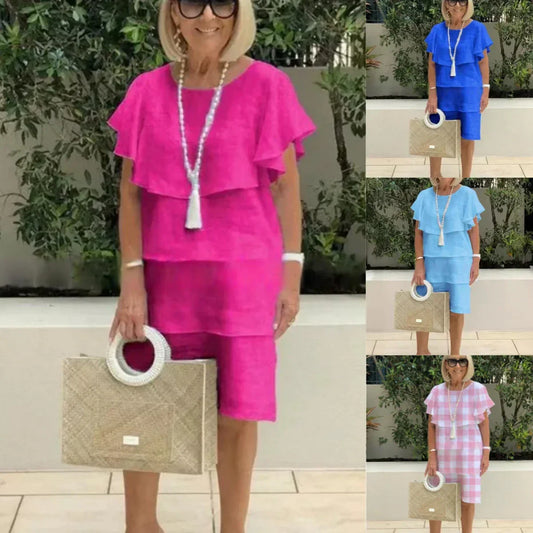 Knälång chiffongklänning med korta ärmar och volanger