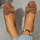 Loafers med kilklack och dekor av rosettknut