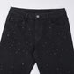 Smalpassade svarta jeans med strassdekorationer