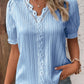 Elegant blus med solid spets och V-hals