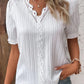Elegant blus med solid spets och V-hals